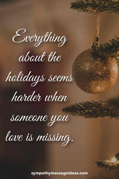 a christmas ornament hanging from a tree with the words, everything about the holidays seems harder when someone you love is missing