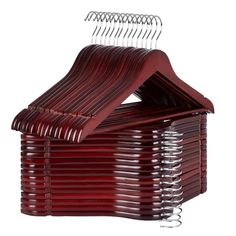 a stack of red clothes hangers on a white background