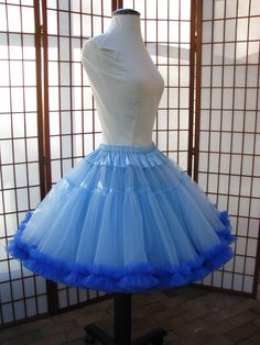 "This listing is for a custom order for a super-full double layer nylon organdy petticoat with satin waist and chiffon bottom ruffles. The pictured petticoat was designed for a 26.5\" (67,3 cm) waist and is 20\" (50,8 cm) long. It is displayed on a dress form with a 22\" (55cm) waist. You can choose any length you need. I will lengthen each of the tiers to achieve extra length. If you would prefer that I add another tier to achieve extra length, then the price will increase substantially. If you Fitted Organza Petticoat With Ruffles, Fitted Blue Tulle Petticoat, Blue Fitted Tulle Petticoat, Fitted Tulle Petticoat With Ruffles, Blue Fitted Petticoat For Party, Fitted Vintage Tulle Petticoat, Fitted Spring Organza Petticoat, Spring Fitted Organza Petticoat, Fitted Organza Petticoat For Spring