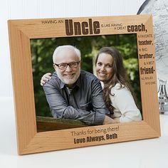 a wooden frame with an image of two people and the words uncle, i love you always