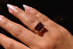 A natural Brazilian amethyst, handcrafted in Peru, set in an 18k solid gold band. Size: 6.5 Other size: 12 - 15 working days. 14k Yellow Gold Emerald-cut Amethyst Ring, Modern Yellow Gold Amethyst Gemstone Ring, Modern Yellow Gold Amethyst Ring, Luxury Amethyst Ring Emerald Cut, Luxury Emerald Cut Amethyst Ring, Modern Yellow Gold Amethyst Ring Gift, Luxury Yellow Gold Amethyst Ring With Emerald Cut, Timeless Gold Amethyst Ring, Luxury Solitaire Amethyst Ring