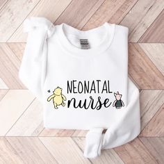 a white sweatshirt with the words neonatal nurse and winnie the pooh on it