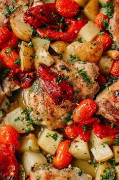 chicken, potatoes and tomatoes with herbs in a skillet