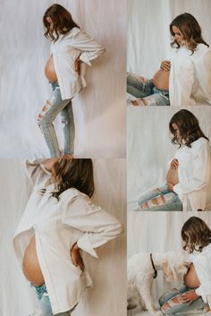 a woman in white shirt and jeans sitting on floor next to dog