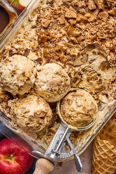 an ice cream sundae with apples and caramel sauce in the background, surrounded by other desserts