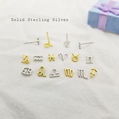 Tiny sterling silver zodiac earrings. These sterling silver Zodiac earring studs are the perfect minimalist yet meaningful gift for both children and adults! Crafted from nickel free, hypoallergenic sterling silver. These earrings feature the iconic design of the 12 zodiac signs. These tiny earrings are lightweight and comfortable and be worn day and night. Unique and stylish, an ideal gift for birthday, anniversary, or any other occasion. Comes with two color options of silver and gold plated. Christmas Gift Kids, Zodiac Earrings, Silver Butterfly Earrings, Unisex Earrings, Libra Scorpio, 12 Zodiac Signs, 12 Zodiac, Kids Earrings, Tiny Earrings