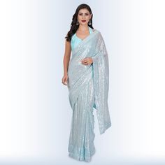 Introducing our stunning "1 Minute Sequin Saree - Baby Blue"! ✨ Elevate your elegance with this georgette masterpiece that effortlessly combines tradition with modern style. 🌟Designed for the busy, modern woman, this saree comes pre-stitched, saving you precious time on draping. Its mesmerizing baby blue hue is complemented by intricate sequin detailing that sparkles with every move you make. 💃The included backless blouse adds a touch of allure, making you the center of attention at any event. Blue Georgette Pre-draped Saree With Self Design, Festive Blue Wedding Pre-draped Saree, Fitted Blue Pre-draped Saree For Festive Occasions, Elegant Blue Pre-draped Saree For Festive Occasions, Blue Fitted Pre-draped Saree For Reception, Festive Blue Georgette Pre-draped Saree, Elegant Blue Blouse With Mirror Work, Elegant Blue Traditional Drape Pre-draped Saree, Formal Blue Saree