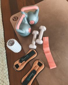 an assortment of exercise equipment sitting on top of a table