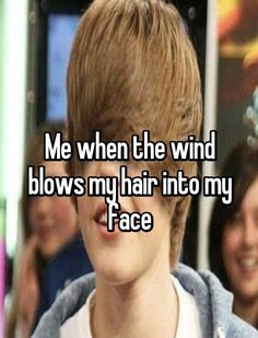 a boy with blonde hair and the words me when the wind blows my hair into my face