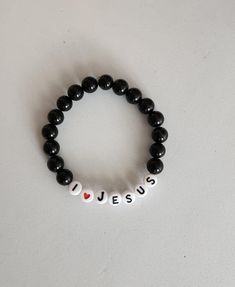 I Love Jesus, ONYX Bead Bracelet, 8MM round bead, Black Stone, Handmade, Stretchy Bracelet, Christian, Religious, Gift for Birthday Black ONYX Stone Bracelet. Super Versatile to match any outfit. Note: All of the bracelets feature an elastic string for varying wrist sizes 7"-9" (can still fit wrists slightly smaller and larger because of the stretch, just keep in mind it will be a bit more loose or snug fitting depending on your size). There are many ways to get your wrist measurement: *Use stri Casual Black Friendship Bracelets With Round Beads, Casual Black Round Beads Friendship Bracelets, Casual Black Round Beads Friendship Bracelet, Casual Black Friendship Bracelets With 8mm Beads, Black Beaded Spiritual Friendship Bracelets, Spiritual Black Beaded Friendship Bracelets, Black Beads Jewelry For Friendship, Black Beaded Friendship Jewelry, Black Friendship Bracelets With Colorful Beads As Gift