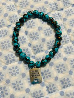 This turquoise siderolite bracelet with God charm will be the perfect gift!  Size: 7 inches This beautiful bracelet is strung on sturdy stretch cord and handmade.  $1.99 shipping  1-3 days for item to be shipped Turquoise And Brown, Brown Shades, Flower Charm, Beautiful Bracelet, Jewelry Bracelets, Accessory Gift, Beaded Bracelets, Size 7, Shades