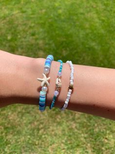 Handmade ocean bracelet set! If you have any questions, please message me! Blue Beaded Bracelets With Starfish Charm, Blue Beaded Strand Bracelet With Starfish Charm, Blue Starfish Beaded Bracelets For Vacation, Beachy Beaded Bracelets With Starfish Charm, Blue Beaded Friendship Bracelets For Beach Season, Blue Beaded Bracelets With Round Beads For Beach Season, Blue Beaded Bracelets For Beach Season, Blue Starfish Bracelets For Summer, Blue Ocean-inspired Beaded Bracelets For Beach Season