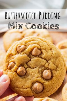 Hand holding baked butterscotch cookie Butterscotch Chip Desserts, Chewy Butterscotch Cookies, Salted Butterscotch Cookies, Desserts With Butterscotch Chips, Butterscotch Pudding Mix Recipes, Easy Butterscotch Desserts, Recipes That Use Butterscotch Chips, Easy Desserts With Butterscotch Chips, Cookies With Pudding Mix In Them