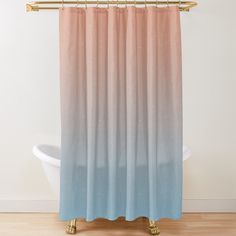 a shower curtain with pink and blue ombreaches on the side, in front of a white bathtub