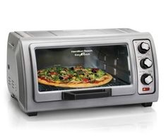 a silver toaster oven with pizza in it