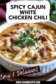 A bowl of Spicy Cajun White Chicken Chili showcasing tender chicken and white beans, perfect for a cozy dinner. This image highlights the 'Cajun white chicken chili' that adds a spicy twist to classic flavors and makes for an incredible easy meal solution. Cajun Soup, Creamy White Beans, Cajun Spices, Classic Chili, Hearty Chili, White Chicken Chili, Spicy Chili, White Chicken, Pleasing Everyone