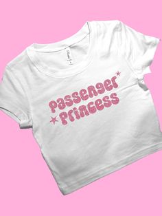 Passenger Princess SNUG FIT Crop Top | Cute Crop Top | Graphic Top | Gift For Her | Y2K Baby Tee | Gift For Girlfriend Y2K Crop Comfy Top to Lounge in! Actual item may be lighter/darker than pictured. M A T E R I A L S - SNUG FIT - 100% RING SPUN COTTON - Shoulder Taping S I Z I N G - Size chart is available on our listing photos. S H I P P I N G  &  P R O D U C T I O N  T I M E - Production Time is 5 Business Days. (May be delayed during the Holiday Season) - Shipping Time is 2-6 Business Days. Silly Shirt, Stylish Crop Top, Y2k T Shirt, Trendy Crop Tops, Y2k Crop Top, Cute Gifts For Her, Baby Crop Top, Graphic Crop Top, Baby Tees Y2k