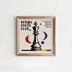 a black and white chess piece in a wooden frame on the wall next to a sign that says nerdra chess club