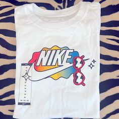 Super Cute T-Shirt W/Heart Glasses Nike Logo - Bright Colors Brand New - Never Worn Nike Retro T-shirt With Letter Print, Retro Nike T-shirt With Letter Print, Cool White T-shirt With Funny Print, Multicolor Logo Print T-shirt For Spring, Fun White Top With Logo Print, Cool White Tops With Graphic Design, Fun White T-shirt For Streetwear, Sporty White T-shirt With Cartoon Print, Fun White T-shirt