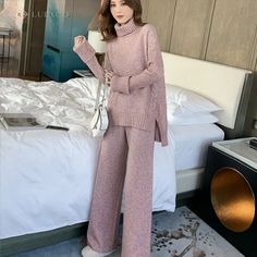 Indulge in luxury with this exquisite two-piece knitted set. Made from a soft, knitted polyester blend, this set features a turtleneck sweater and wide-leg pants with ribbed edging for a comfortable and chic fit. The twist-knit detail adds a touch of sophistication, making this set a must-have for any fashion-forward wardrobe. Attention! Sizes: In some cases, our clothing sizes may be Asian size , not US/European size. As a result, garments may run 1-2 sizes smaller than your usual size so pleas Crop Top With Plazo, Top With Plazo, Athleisure Office, Split Sweater, Statement Scarf, Jeans And Ankle Boots, Straight Clothes, Knitted Suit, Sweatshirt Style