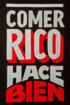 the words comer rico have been painted on a black background