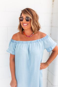 Get ready to slay the summer heat in The Right Time Chambray Dress! This frayed hem dress is perfect for hot days with its lightweight fabric, off the shoulder design, and relaxed fit. Plus, its versatile denim color makes it a must-have for transitioning into fall. Even expecting moms can rock this bump-friendly dress. Sizing: Ash is 5'4" 36C and is wearing a size Small Fit: Relaxed. If in between sizes, we recommend sizing down 1 size. Color: Light Denim Off the Shoulder Dress Raw Hem Ruffle D Summer Denim Blue Tops, Denim Blue Summer Top For Day Out, Summer Denim Blue Tops For Day Out, Denim Blue Summer Tops For Vacation, Summer Vacation Denim Blue Tops, Denim Blue Tops For Summer Vacation, Summer Washed Blue Denim Top, Summer Washed Tops For Day Out, Summer Denim Blue Top For Beach