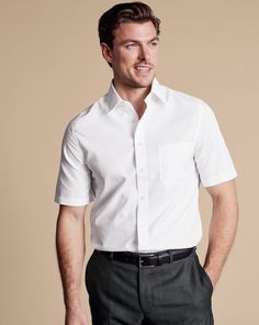 100% 2-ply cotton, Available in classic and slim fit, Non-iron, Classic Collar, Classic and slim fit: back pleats, Short sleeve, Chest pocket, Machine washable - Non-Iron Poplin Short-Sleeve Shirt - White | Men's Charles Tyrwhitt Non-Iron Poplin Short-Sleeve Dress Shirt - White Size Medium Cotton Charles Tyrwhitt Shirt, White Dress Formal, Smart Jackets, Morning Suits, Collarless Shirt, Italian Suit, Business Casual Shirts, Navy Blue Suit, Charles Tyrwhitt