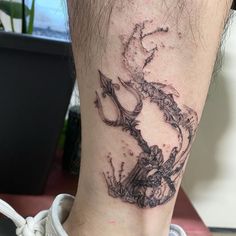 a tattoo on the leg of a person with an inked image of a horse