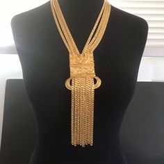 495.00 USD Vintage goldtone metal statement necklace in very good vintage condition. Measures 20 inches long of wearable length and the Tassel pendant portion is 7 1/2 inches long by just under 3 inches at its widest point. Definitely a statement piece that will get noticed and sure to become a favorite. Long Metal Tassel Necklace With Chain, Gold Metal Tassel Dangle Necklace, Metal Long Tassel Necklace, Gold Metal Dangle Tassel Necklace, Long Metal Tassel Necklace, Gold Tassel Necklace With Adjustable Chain, Bohemian Gold Tassel Necklace For Party, Crown Earrings, Lion Necklace