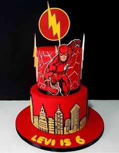 a red cake with the flash logo on it