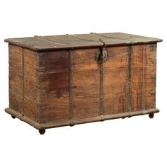 an old wooden chest with wheels on it's sides and two doors at the top