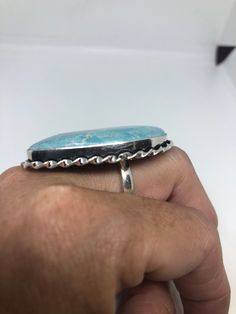 Large genuine aqua blue Larimar Vintage ring Low content silver not sterling. Size 9 Can be re sized at my jeweler. $10 All rings are shipped in a nice gift box. Check out our over a THOUSAND great reviews Engraving is $4 per letter and is not always perfect depending on the piece. It can take a few days if the jeweler is busy. This is payable to Paypal Judithsltd@gmail.com Elegant Blue Larimar Turquoise Ring, Blue Turquoise Sterling Silver Ring, Collectible Round Turquoise Ring, Oval Silver Larimar Turquoise Ring, Adjustable Larimar Turquoise Ring, Polished Turquoise Ring For Anniversary, Adjustable Turquoise Larimar Ring, Sterling Silver Turquoise Ring With Polished Finish, Unique Larimar Turquoise Ring As Gift