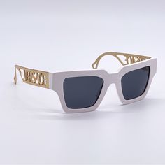 100% New Authentic Eyewear With Full Package Brand: Versace Model: Ve4431 401/87 50-22-145 Condition: New With Full Package Frame Material: Metal, Acetate Frame Color: White, Gold Lens Color: Grey Size: 50-22-145 100% Uv Protection Made In Italy Item Includes: - Authentic Eyewear - Certificate Of Authentic - Authentic Case, Cloth - Cleaning Cloth We Guarantee That All Our Items Are 100% Authentic And Brand New. Elegant White Sunglasses For The Beach, White Square Frame Sunglasses For Summer, Luxury White Sunglasses With Uv Protection, Classic White Sunglasses For The Beach, Designer White Sunglasses With Polarized Lenses, Chic White Square Frame Sunglasses, Luxury Optic White Sunglasses For Summer, Modern White Wayfarer Sunglasses, White Square Frame Sunglasses For Beach