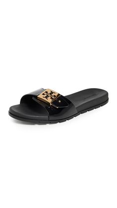 PRICES MAY VARY. Rubber sole Adjustable strap with gold-tone logo emblem, Molded rubber footbed Luxury Slides, Logo Emblem, Emblem Logo, Tory Burch, Special Features, Rubber Sole, Slides, Gold Tones, Adjustable Straps