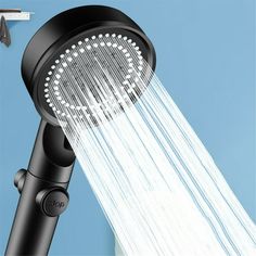 the shower head is spraying water from it's sprinkles on a blue background