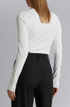 A touch of added stretch enhances the trim fit of a ribbed cotton T-shirt you'll wear from one season to the next. 21" length (size Small) Crewneck Long sleeves 95% cotton, 5% elastane Dry clean Imported Classic Ribbed Tops For Workwear, White Tops With Ribbed Neckline For Work, Classic Tops For Workwear With Ribbed Neckline, Fitted White Top With Ribbed Neckline, White Ribbed Elastane Top, Crew Neck Elastane Tops For Work, Classic White Elastane Top, Elastane Crew Neck Top For Work, White Ribbed Tops For Workwear