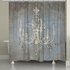 a white chandelier hanging from a shower curtain