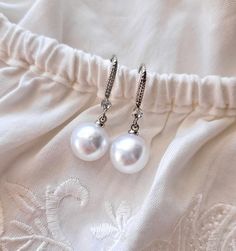 This Bridal Pearls Earrings,a beautiful and delicate bridal accessory for brides.  On the wedding day, every bride wants to look fantastic. This delicate earrings pearls will be a magical addition to your look on your happiest day.  This will emphasize the ease and sophistication of your image.  -Material- simulated pearl   -Colors- white and silver  - Unique handmade.  Wedding - is one of the Pearl White Sterling Silver Bridal Earrings, Pear-shaped Sterling Silver Pearl Earrings For Wedding, Nickel-free Silver Pearl Earrings For Wedding, Vintage White Pearl Drop Bridal Earrings, Silver Pearl Bridal Earrings Pear-shaped, Wedding Drop Earrings, Round Pearl Earrings, Silver Bridal Earrings, Drop Earrings Silver