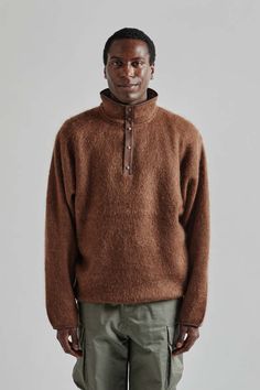 Nanamica pullover mohair sweater - brown    the pullover mohair sweater is crafted from sustainably sourced mohair yarn offering both comfort and style. the brushed texture gives it a soft voluminous feel reminiscent of 1990s outdoor fleece jackets. designed with a minimalist aesthetic this sweater features an oversized silhouette for a relaxed and cozy fit. Layering Jacket, European Aesthetic, Fleece Jackets, Mohair Yarn, Knit Alpaca, Favorite Daughter, Mohair Sweater, Contemporary Outfits, Cozy Fits