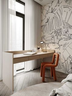 a room with a desk, chair and wallpaper on the walls that has plants drawn on it