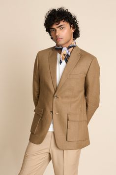 Khakhi blazer in a linen base with notch lapel collar, 2 cargo pockets, 1 barchetta pocket and loop detail at the collar.
Components: 1
Neckline: Notch Lapel
Sleeve Type: Long
Fabric: 100% Linen
Color: Beige
Other Details: 
Vented back
Sleeves with button closure
Unlined jacket
Closure: Button front
Note: The scarf, inner T-shirt and pant worn by the model is not for sale
Occasion: Cocktail and Reception - Aza Fashions Unlined Jacket, Blazer For Men, Blazer Men, Blazer Beige, Linen Color, Blazers For Men, Shirt And Pants, Lapel Collar, Aza Fashion