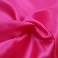 a close up view of a pink satin fabric