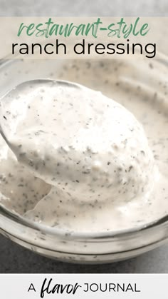 a spoon full of ranch dressing in a glass bowl with the words, restaurant style ranch dressing