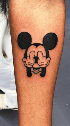 mickey mouse tattoo on the leg