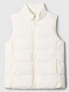 Quilted water-resistant outer. 100% recycled wellon fill. Sleeveless. Stand collar, zip front. Front slant pockets. To view a copy of this product's label, copy the style number and search this database Law Label Lookup #496933 Woman’s Vest, Puffer Jacket No Sleeves, White Puffer Vest Outfit, White Vests, Cream Puffer Vest, Puffer Vest White, Puffer Jacket Vest, Puffer Vest Outfit, Lululemon Vest