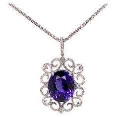 This stunning tanzanite is set in a gorgeous, symmetrical diamond setting that further highlights the top quality tanzanite. The meticulous details involved in this setting truly catches everyone's attention. Tanzanite: 18.80 cts, Oval shape Diamonds: 1.53 cts, Round Brilliant Metal: 18k White Gold **Comes with a 14k White Gold Chain 16 inch length*** Luxury Tanzanite Fine Jewelry For Wedding And Engagement, Tanzanite Pendant, White Gold Chain, Diamond Rings Design, Key Jewelry, Tanzanite Diamond, Expensive Jewelry, Jewelry Lookbook, Diamond Settings