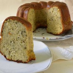 a bundt cake on a plate with one slice cut out