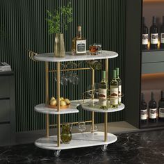 three tiered bar cart with bottles and glasses on it in front of a wine rack