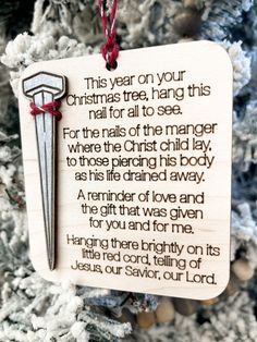 a christmas ornament hanging on a tree with a poem written in the center