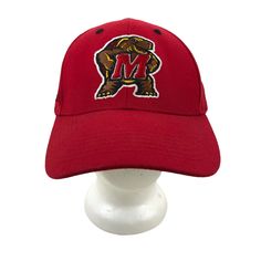 a red hat with the letter m on it